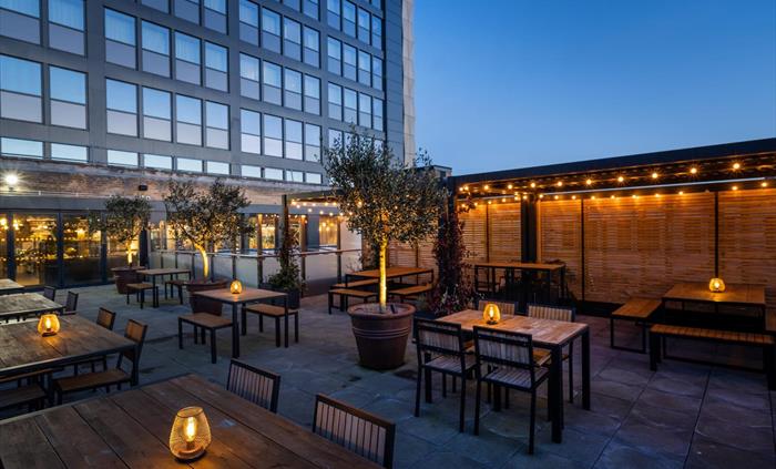 Bar and Kitchen at NP20, Rooftop Terrace at night time with lanterns and fairy lights